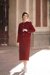a lady in a red wool jacket and skirt two-piece set